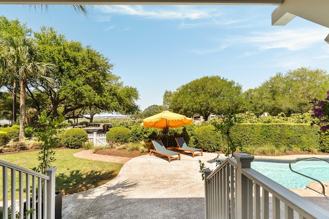 view of patio / terrace with a fenced in pool