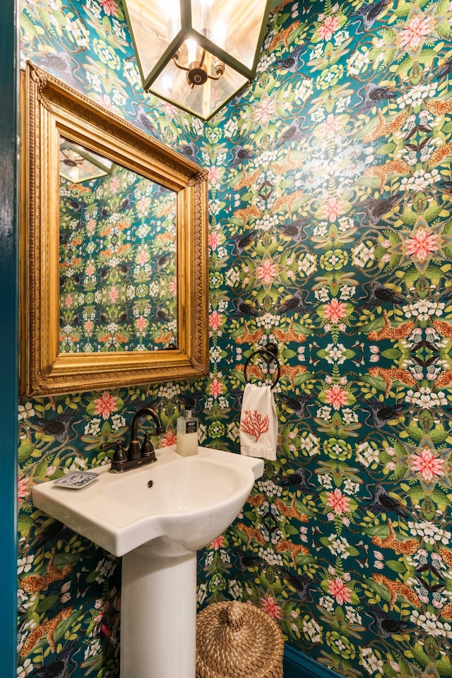 bathroom featuring wallpapered walls