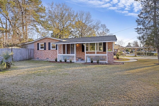 ranch-style home with a porch and a front yard