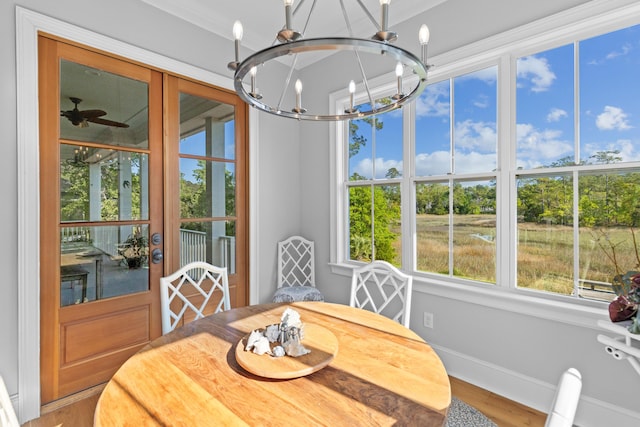 112 Berkshire Dr, Wando, SC 29492 - dining space featuring an inviting chandelier, baseboards, wood finished floors, and a wealth of natural light