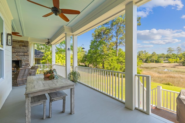 112 Berkshire Dr, Wando, SC 29492 - balcony featuring an outdoor stone fireplace and a ceiling fan
