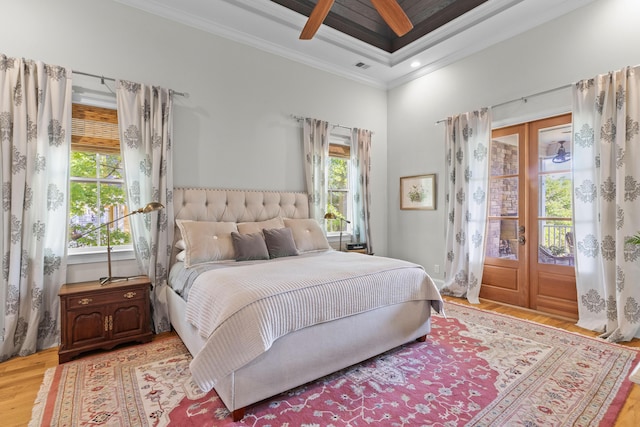 112 Berkshire Dr, Wando, SC 29492 - bedroom featuring light wood-style floors, multiple windows, ornamental molding, and french doors