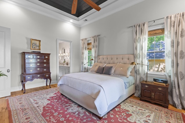 112 Berkshire Dr, Wando, SC 29492 - bedroom with baseboards, wood finished floors, ensuite bathroom, visible vents, and ornamental molding