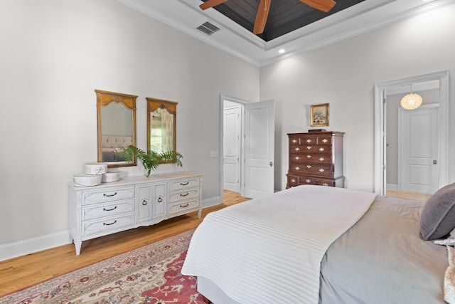 112 Berkshire Dr, Wando, SC 29492 - bedroom featuring visible vents, crown molding, baseboards, light wood finished floors, and a high ceiling