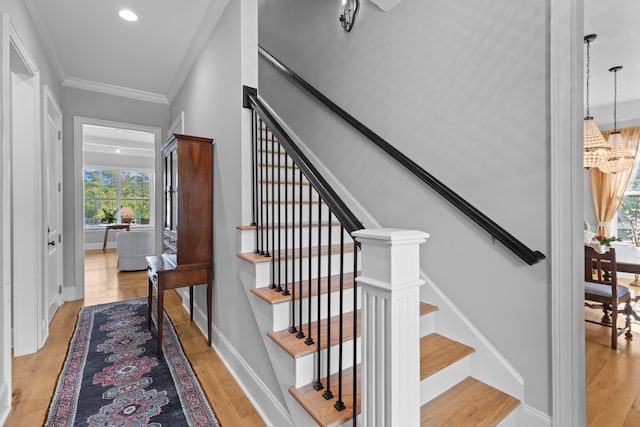 112 Berkshire Dr, Wando, SC 29492 - stairway with crown molding, a chandelier, recessed lighting, baseboards, and wood finished floors