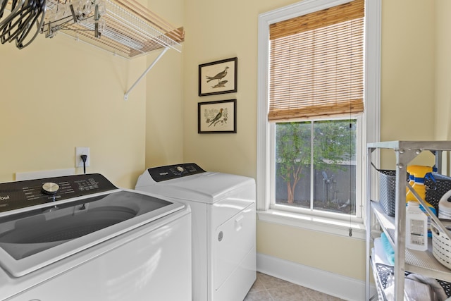 112 Berkshire Dr, Wando, SC 29492 - laundry area with light tile patterned floors, baseboards, laundry area, and washer and dryer