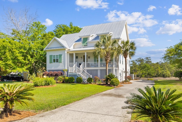 112 Berkshire Dr, Wando, SC 29492 - view of front of house with a porch, stairway, a front yard, driveway, and metal roof