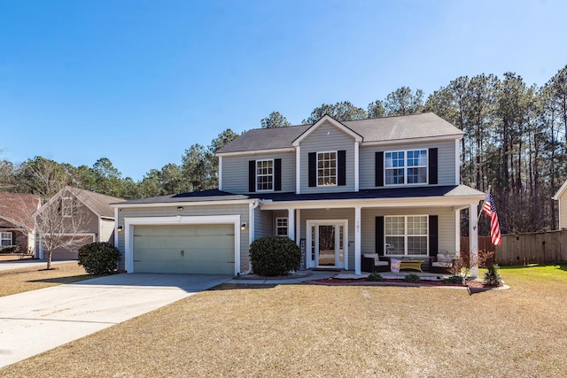 view of front of property featuring an attached garage, covered porch, fence, concrete driveway, and a front yard