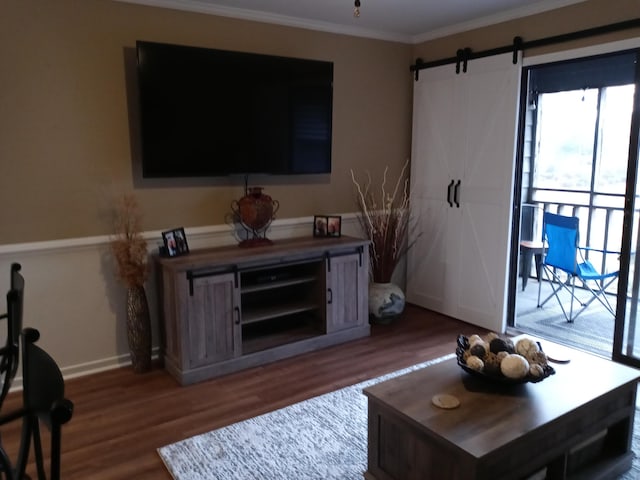 1205 Cypress Pointe Unit A205, Manning, SC 29102 - living room with wood finished floors, ornamental molding, a barn door, and baseboards