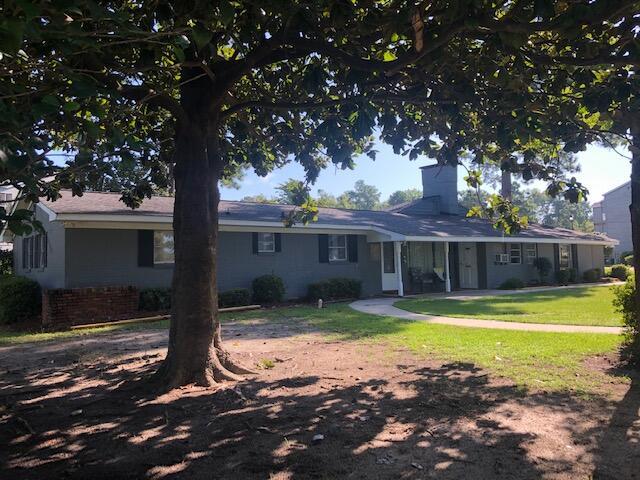1205 Cypress Pointe Unit A205, Manning, SC 29102 - ranch-style home with a chimney and a front lawn