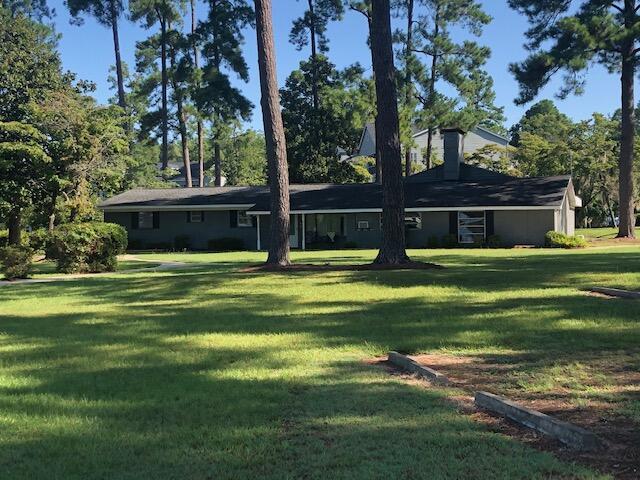 1205 Cypress Pointe Unit A205, Manning, SC 29102 - view of front of house featuring a front lawn and a chimney