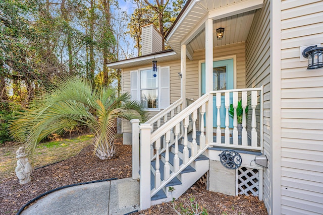 property entrance featuring a chimney