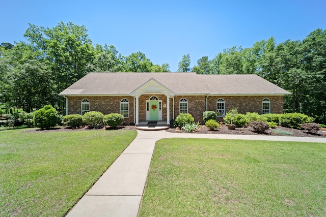 1035 Park Dr, Santee, SC 29142 - ranch-style house with brick siding, a front lawn, and a shingled roof