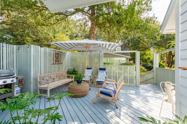 wooden terrace with area for grilling