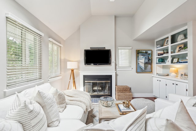 living room featuring lofted ceiling