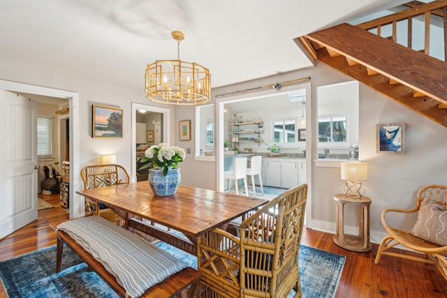 dining area with a chandelier and hardwood / wood-style floors