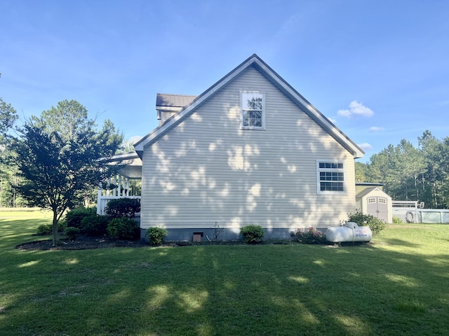 1173 Penny Creek Dr, Ruffin, SC 29475 - view of side of home with a lawn, a shed, and a metal roof