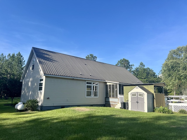 1173 Penny Creek Dr, Ruffin, SC 29475 - rear view of property featuring a shed, a lawn, a metal roof, and crawl space