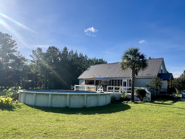 1173 Penny Creek Dr, Ruffin, SC 29475 - outdoor pool featuring a yard and a wooden deck
