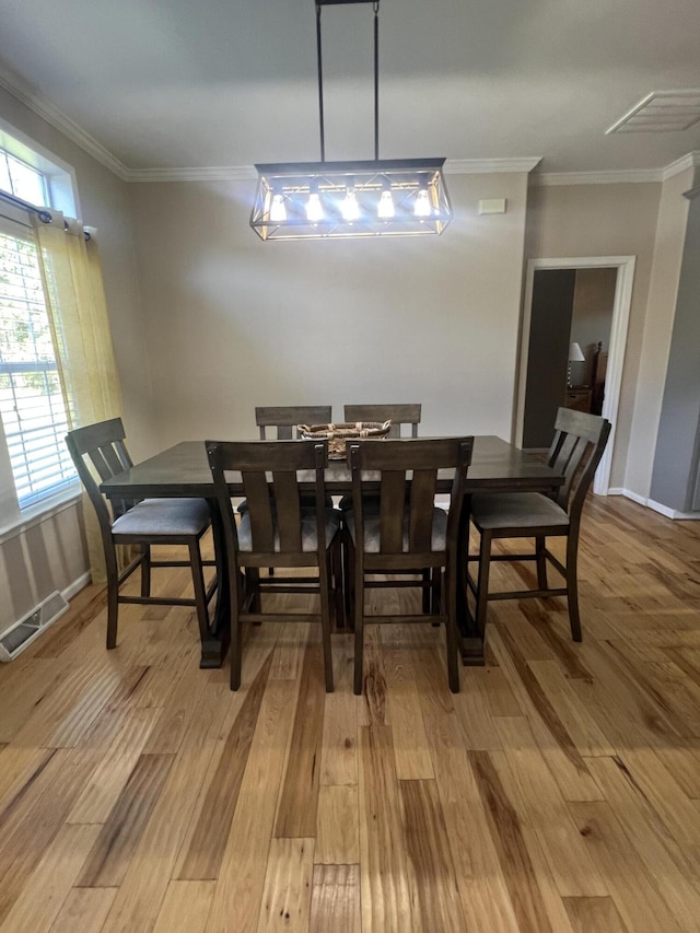 1173 Penny Creek Dr, Ruffin, SC 29475 - dining space featuring light wood-style flooring and ornamental molding
