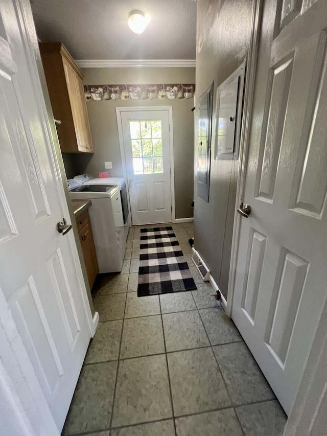 1173 Penny Creek Dr, Ruffin, SC 29475 - laundry room featuring cabinet space, independent washer and dryer, crown molding, and light tile patterned floors
