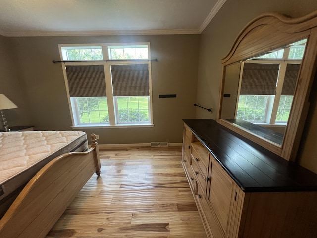 1173 Penny Creek Dr, Ruffin, SC 29475 - bedroom with multiple windows, light wood finished floors, and crown molding