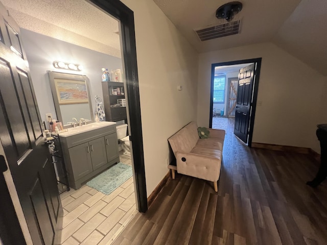 1173 Penny Creek Dr, Ruffin, SC 29475 - hallway featuring light wood-type flooring and lofted ceiling