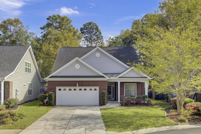 102 Brutus Ln, Summerville, SC 29485 - view of front of property featuring a front yard, an attached garage, brick siding, and concrete driveway