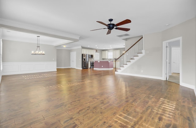 102 Brutus Ln, Summerville, SC 29485 - unfurnished living room with dark wood-style floors, visible vents, stairs, and ceiling fan with notable chandelier