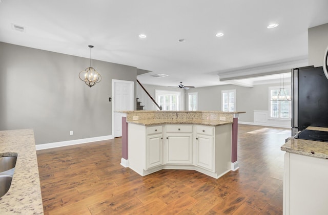 102 Brutus Ln, Summerville, SC 29485 - kitchen featuring white cabinetry, recessed lighting, an inviting chandelier, dark wood-style flooring, and freestanding refrigerator
