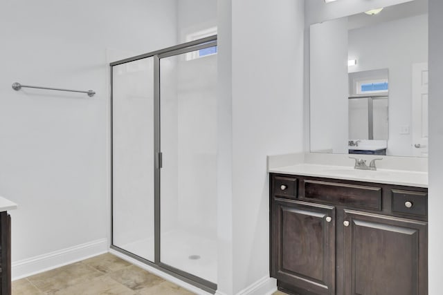 102 Brutus Ln, Summerville, SC 29485 - bathroom with a shower stall, baseboards, vanity, and a healthy amount of sunlight