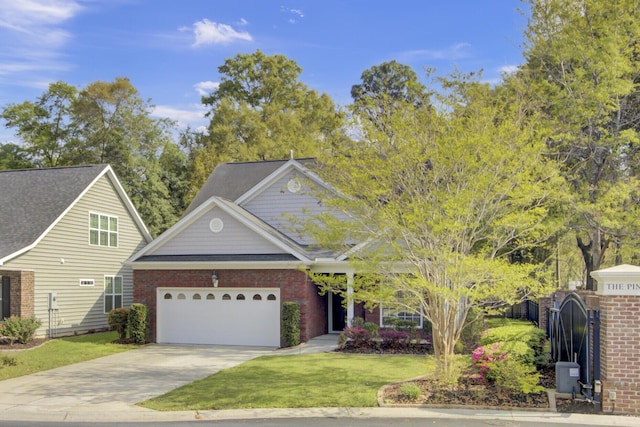 102 Brutus Ln, Summerville, SC 29485 - view of front of home with concrete driveway, fence, a front lawn, brick siding, and a garage