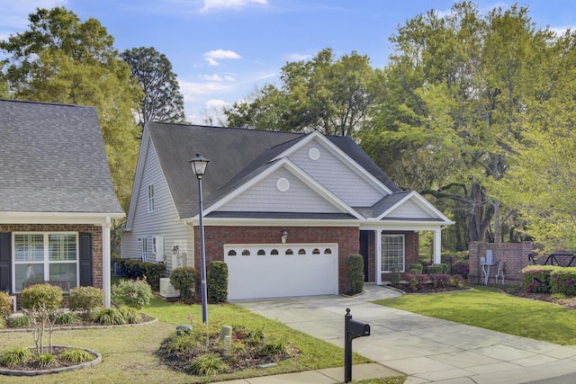 102 Brutus Ln, Summerville, SC 29485 - view of front of house with a front lawn, driveway, a garage, and brick siding