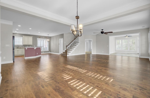 102 Brutus Ln, Summerville, SC 29485 - unfurnished living room with ceiling fan with notable chandelier, dark wood-style floors, baseboards, and recessed lighting