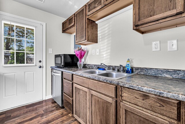 5806 Robinhood Dr, Hanahan, SC 29410 - kitchen featuring black microwave, dishwasher, dark wood-style floors, a sink, and dark countertops