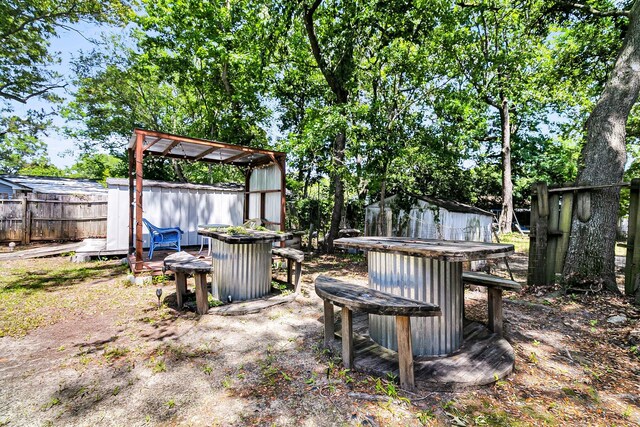 5806 Robinhood Dr, Hanahan, SC 29410 - view of yard featuring fence and a fire pit
