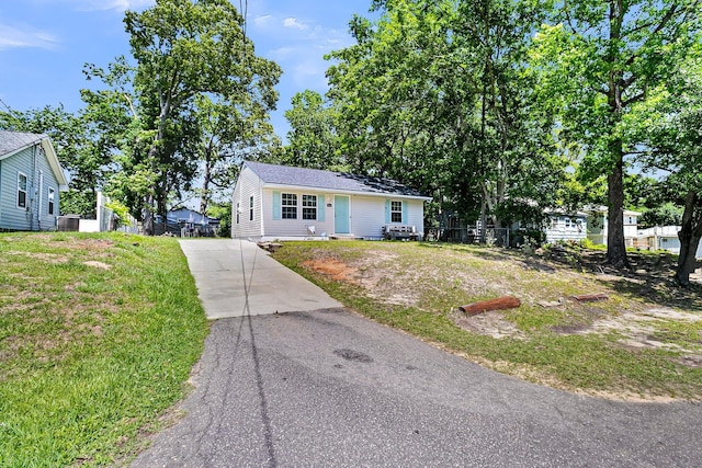 5806 Robinhood Dr, Hanahan, SC 29410 - view of front of property featuring concrete driveway, central air condition unit, and a front yard