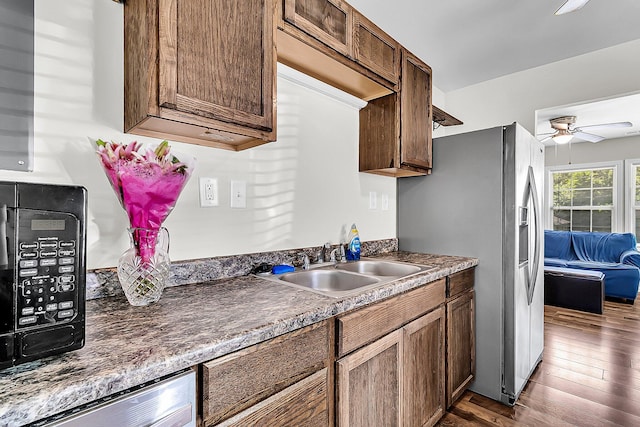 5806 Robinhood Dr, Hanahan, SC 29410 - kitchen featuring a sink, stainless steel refrigerator with ice dispenser, ceiling fan, dark wood-style floors, and dark countertops
