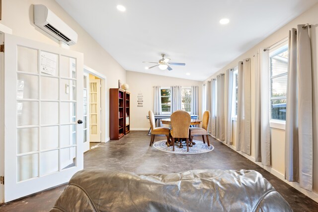 dining area featuring lofted ceiling, ceiling fan, and an AC wall unit