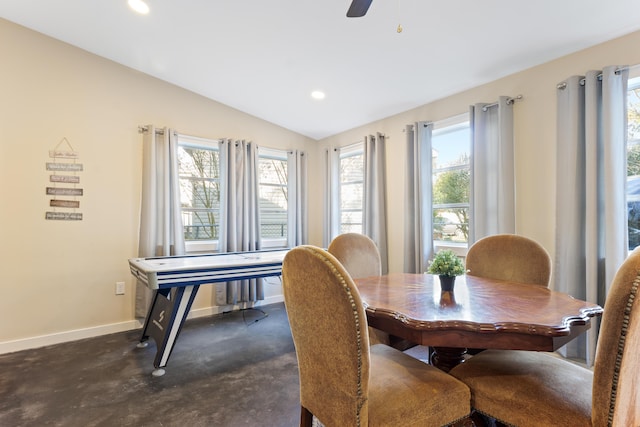 dining room with ceiling fan and lofted ceiling