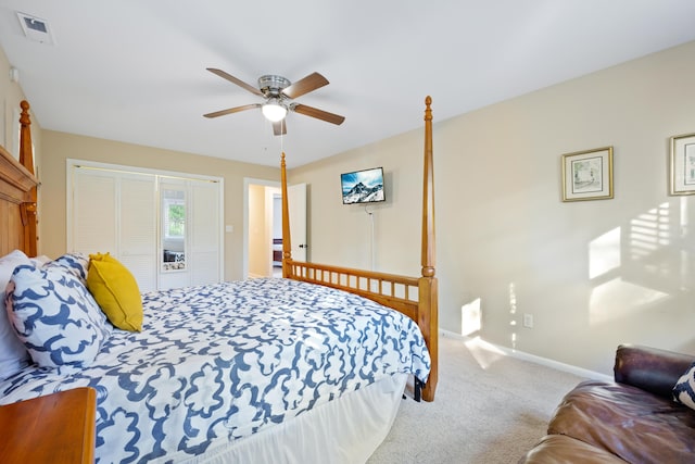 carpeted bedroom with a closet and ceiling fan