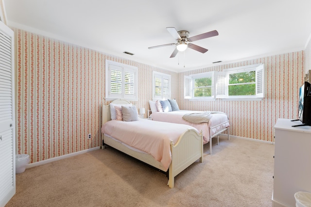 carpeted bedroom featuring ceiling fan