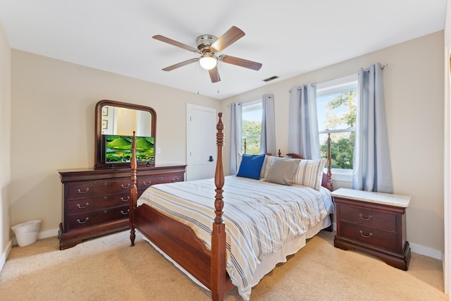 bedroom featuring ceiling fan and light colored carpet