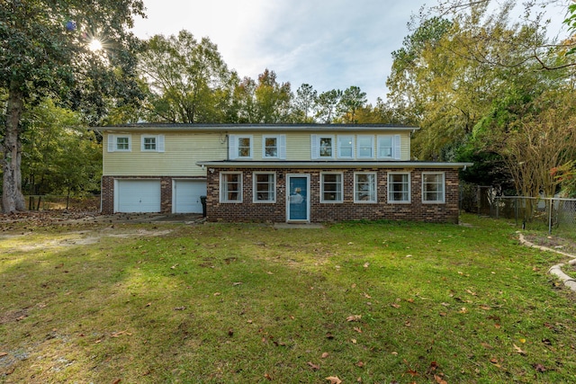 view of front of home featuring a garage and a front yard