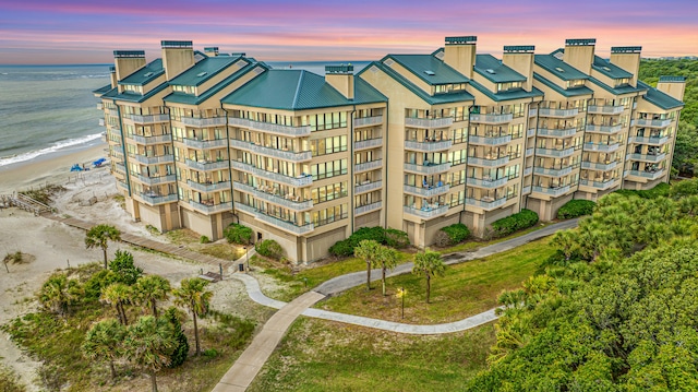 outdoor building at dusk featuring a water view