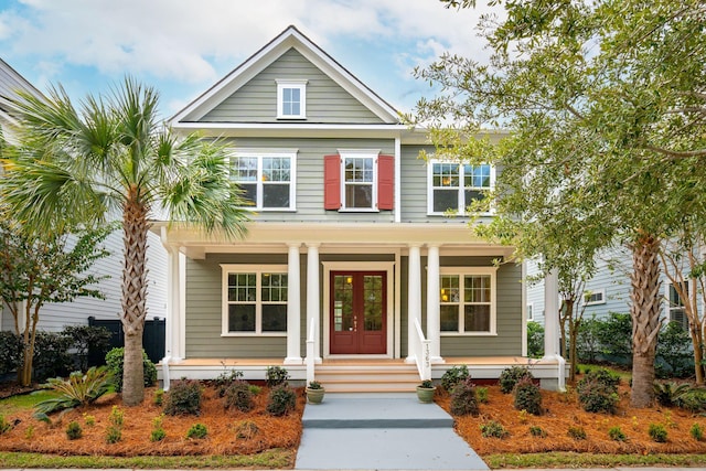 view of front of home with a porch and french doors