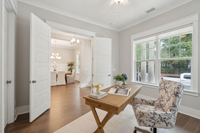 sitting room featuring dark hardwood / wood-style flooring, ceiling fan with notable chandelier, and ornamental molding