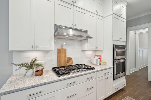 kitchen featuring dark wood-type flooring, white cabinets, and stainless steel appliances