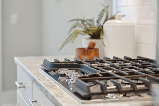 interior details featuring stainless steel gas stovetop