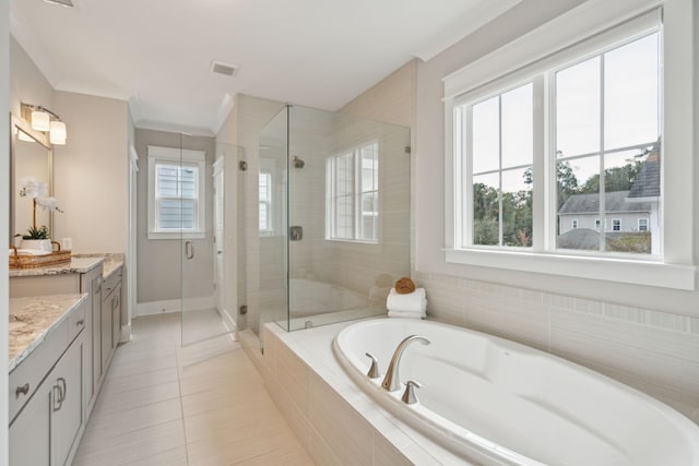 bathroom with tile patterned floors, vanity, plenty of natural light, and plus walk in shower